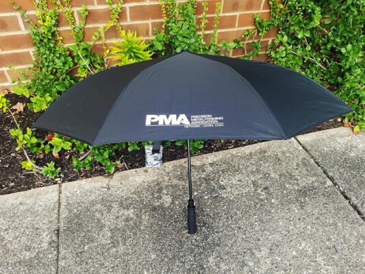 Umbrella with company name printed on it