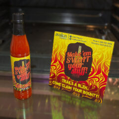 Customized bottle of hot sauce and promotional postcard