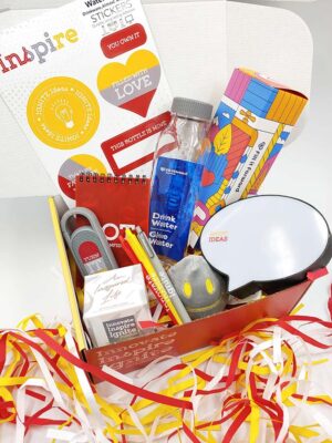 The Innovate, Inspire, Ignite campaign box open, with the contents of promotional items displayed inside.