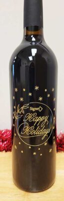 A bottle of wine that says Happy Holidays.